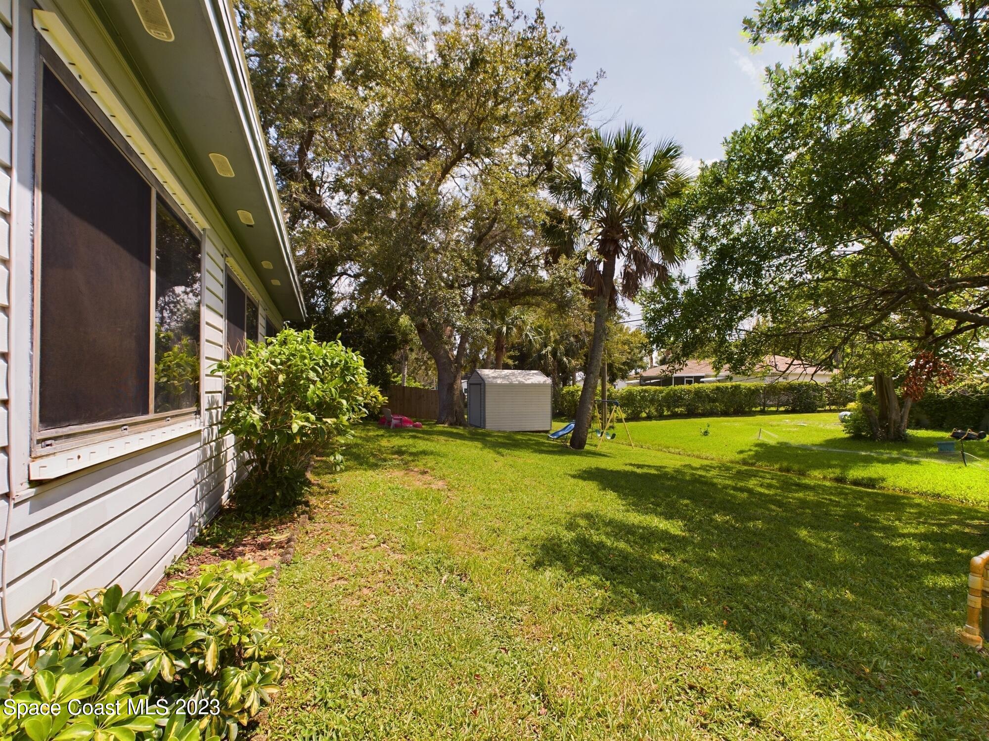 344 Columbus Street Sebastian, FL 32958 - Photo 24 of 35 a view of a house with a yard