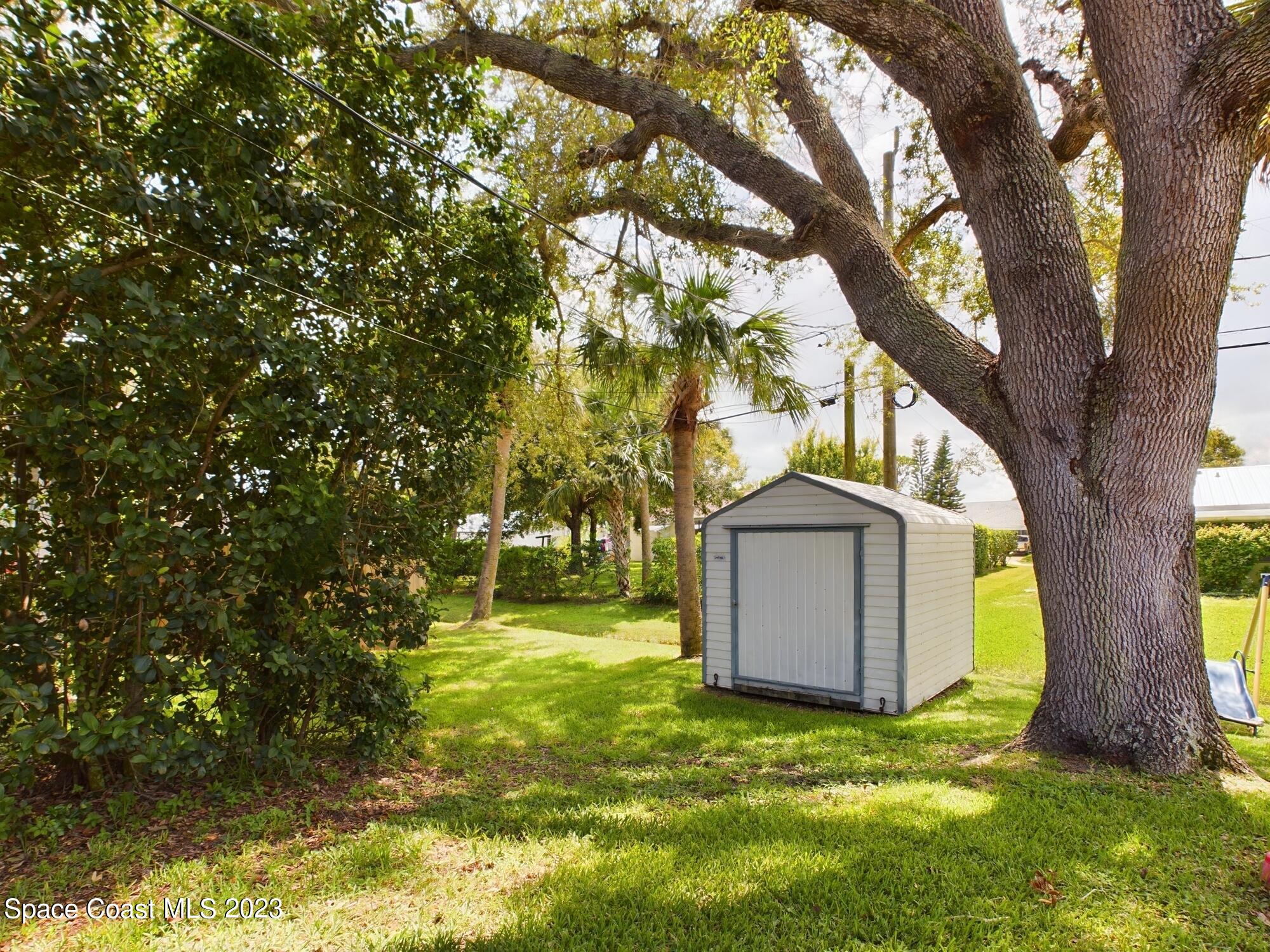 344 Columbus Street Sebastian, FL 32958 - Photo 25 of 35 a front view of a house with a yard