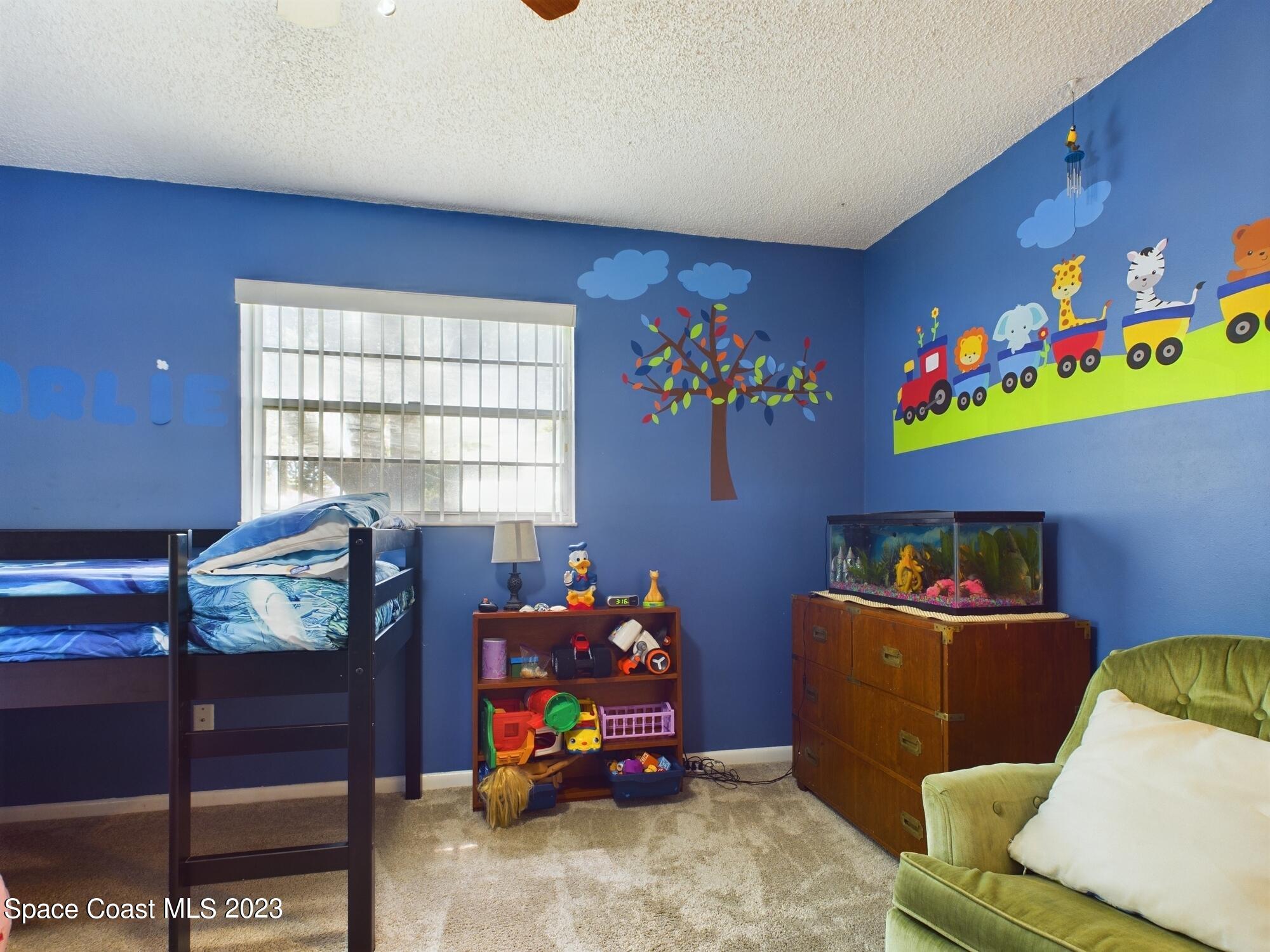 344 Columbus Street Sebastian, FL 32958 - Photo 28 of 35 a room with furniture and a window