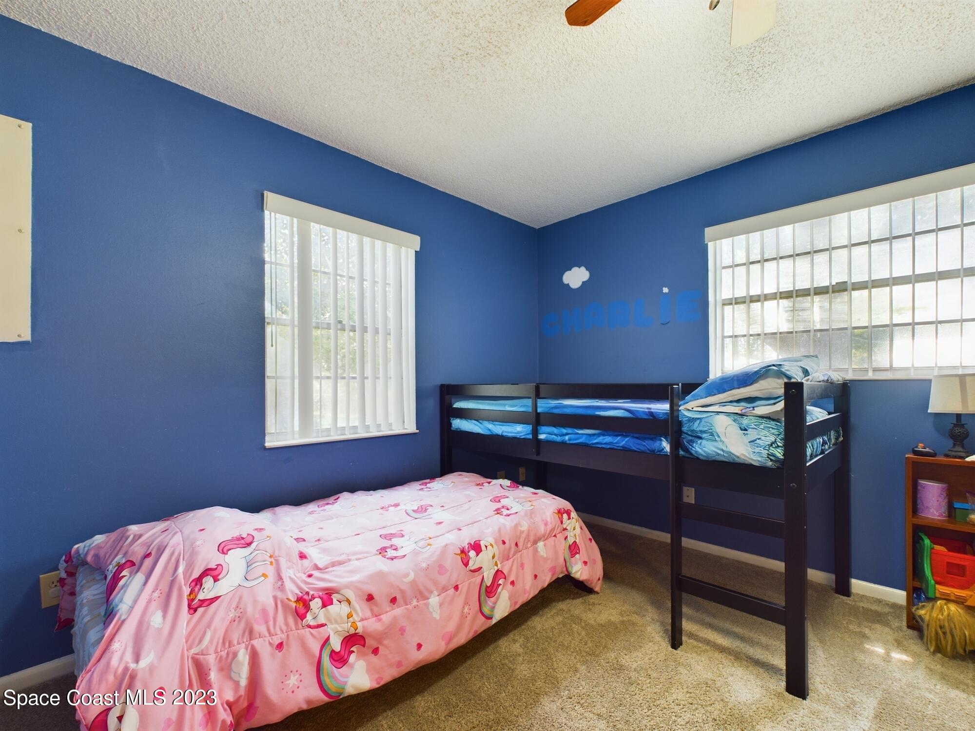 344 Columbus Street Sebastian, FL 32958 - Photo 29 of 35 a bedroom with a bed and a window
