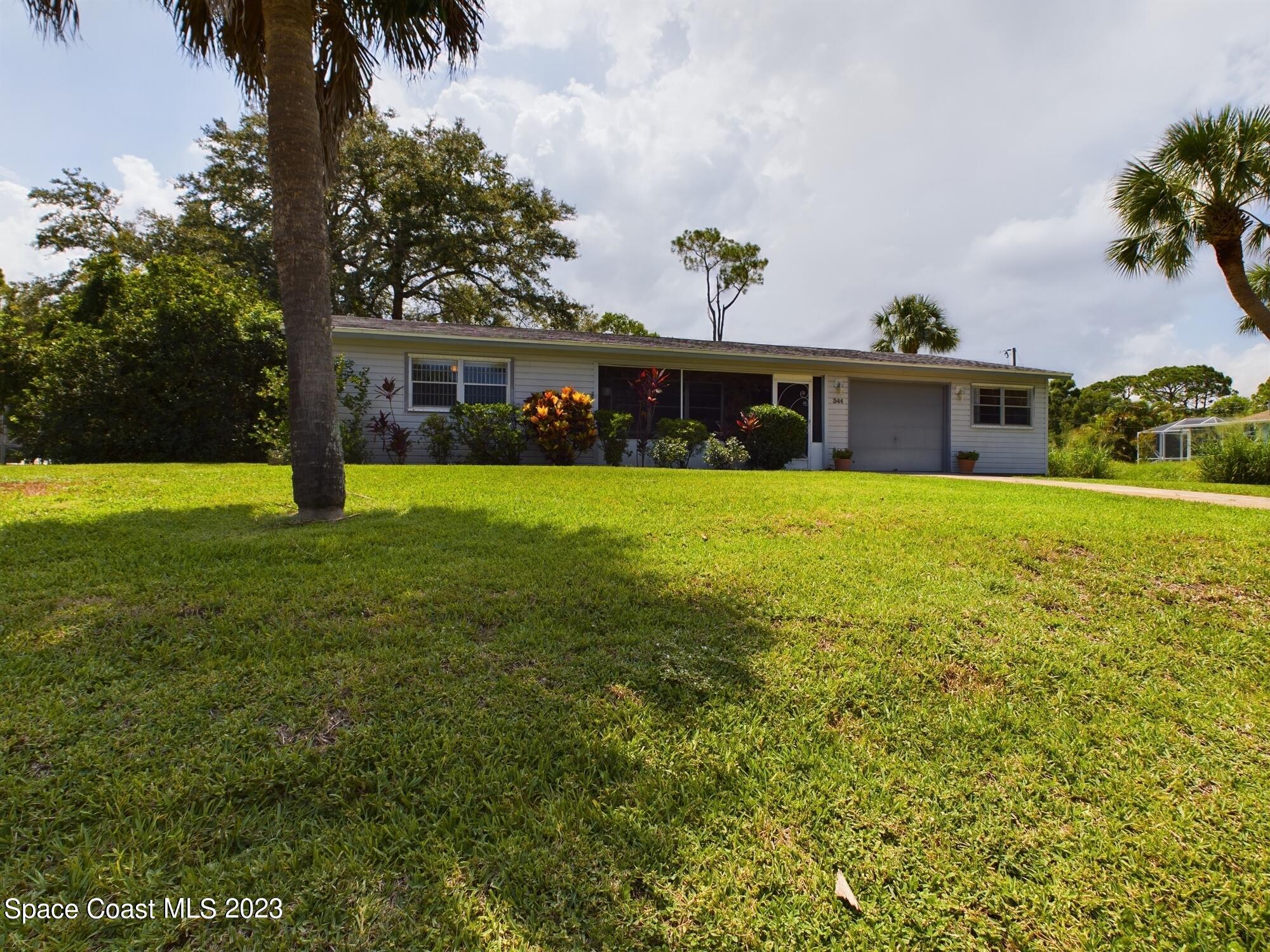 344 Columbus Street Sebastian, FL 32958 - Photo 3 of 35 a front view of a house with yard