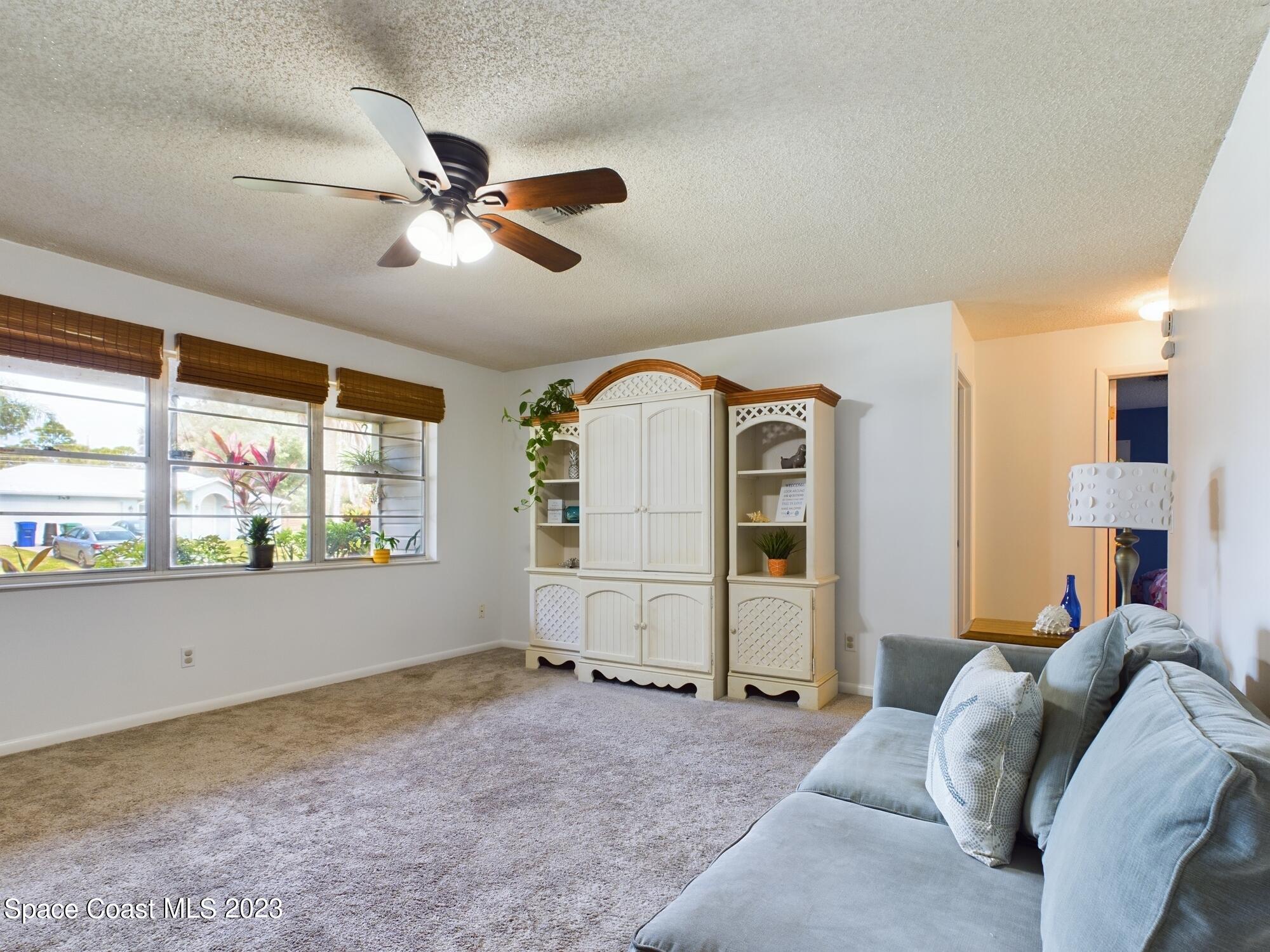 344 Columbus Street Sebastian, FL 32958 - Photo 7 of 35 a bed room with a bed and a large window