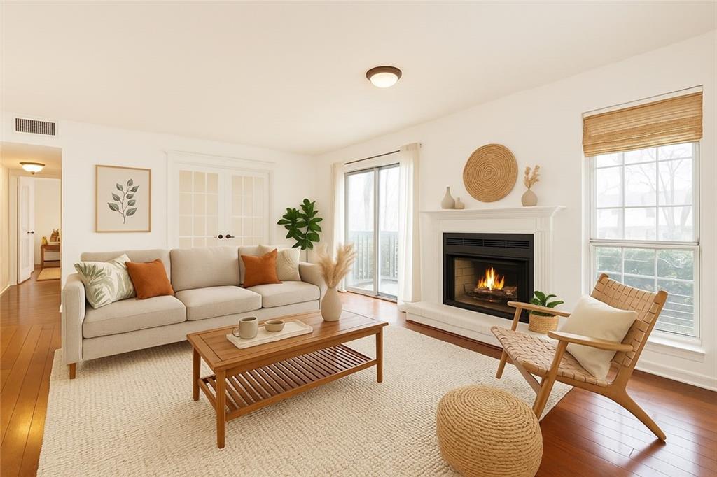 2901 Lenox Way Northeast, Unit 902 Atlanta, GA 30324 - Photo 1 of 34 a living room with furniture and a fireplace