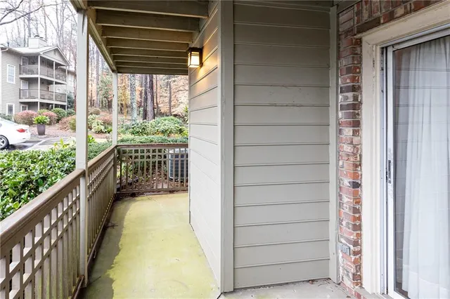 a view of porch with a door