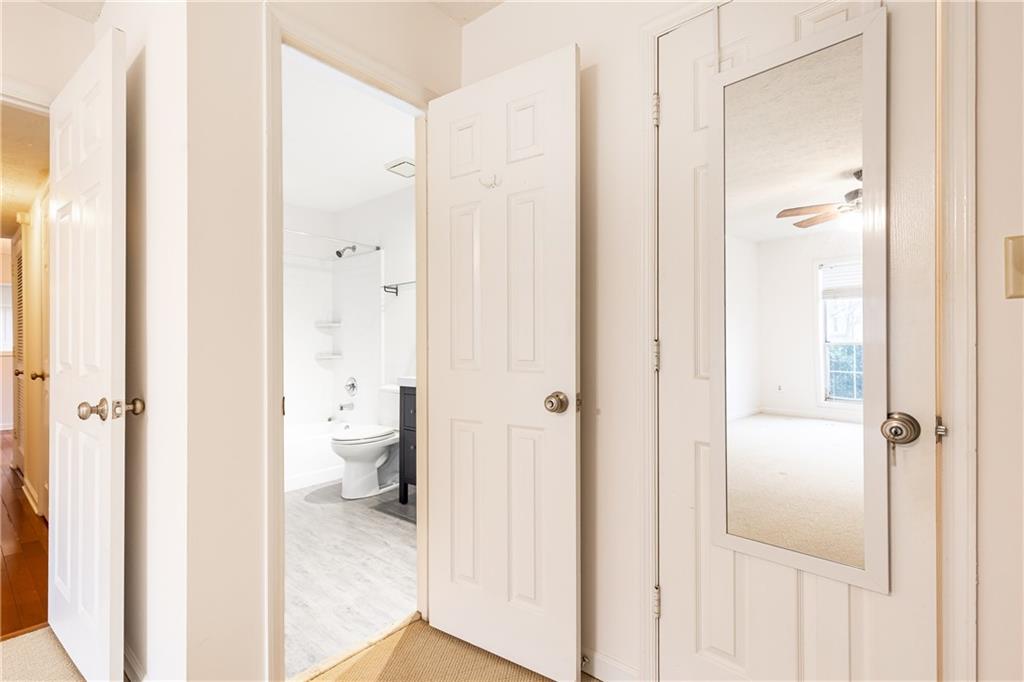 2901 Lenox Way Northeast, Unit 902 Atlanta, GA 30324 - Photo 20 of 34 a bathroom with a shower and a toilet