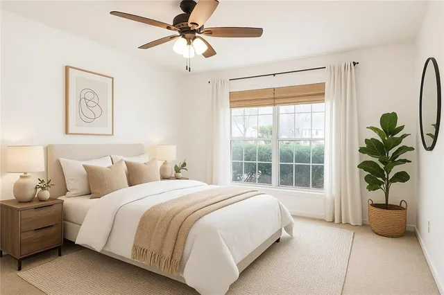 a bedroom with bed and a window