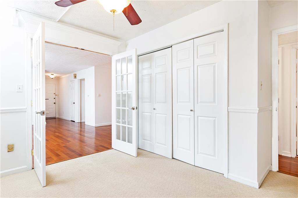 2901 Lenox Way Northeast, Unit 902 Atlanta, GA 30324 - Photo 30 of 34 a view of a hallway with wooden floor