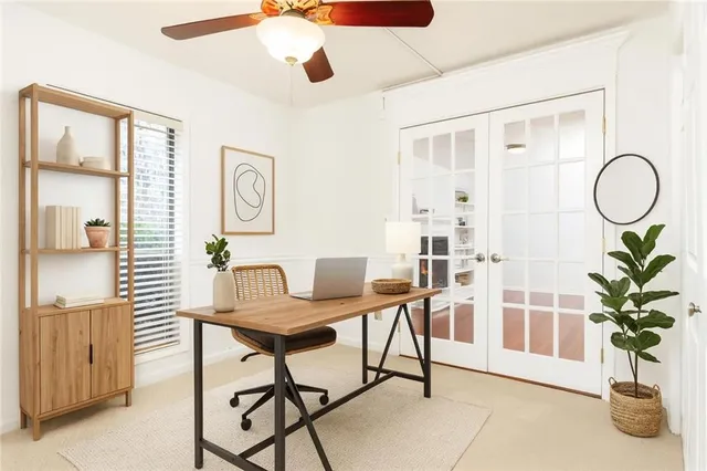a view of a livingroom with furniture and a potted plant