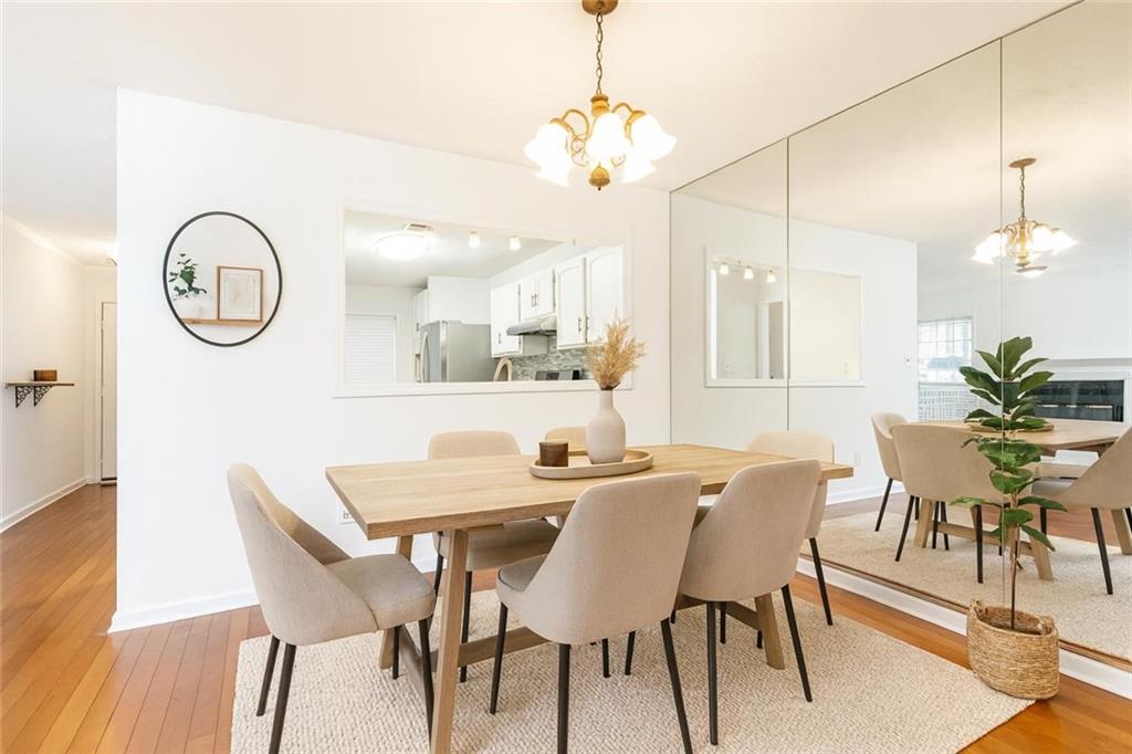 2901 Lenox Way Northeast, Unit 902 Atlanta, GA 30324 - Photo 4 of 34 a view of a a dining table chairs and chandelier