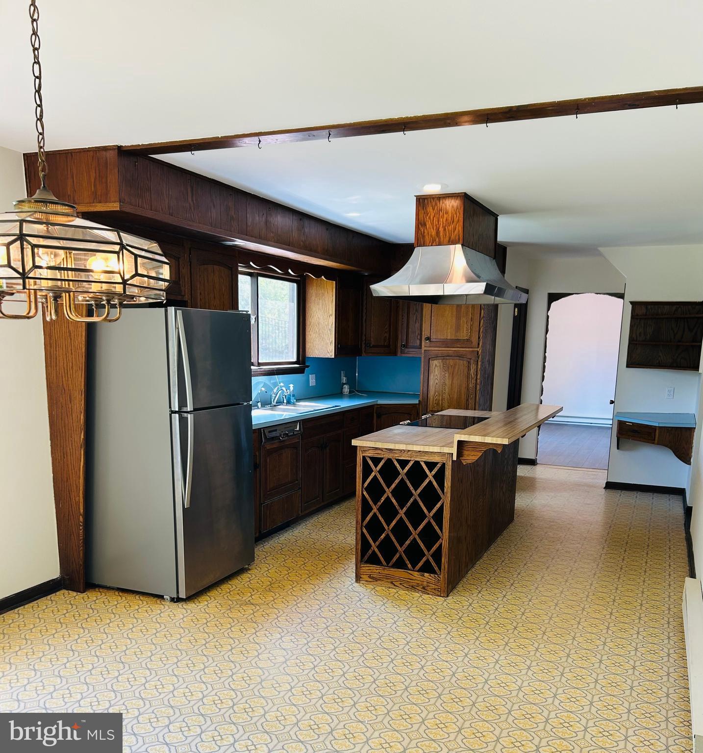 800 Scholl Road Pottstown, PA 19465 - Photo 13 of 49 a kitchen with stainless steel appliances kitchen island granite countertop a refrigerator and a stove
