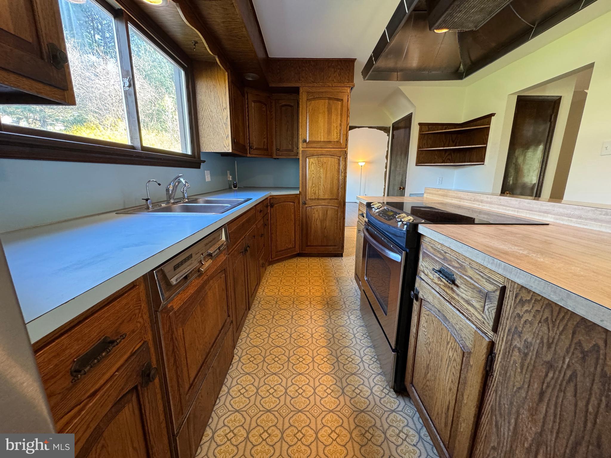 800 Scholl Road Pottstown, PA 19465 - Photo 14 of 49 a kitchen with a sink a refrigerator and window