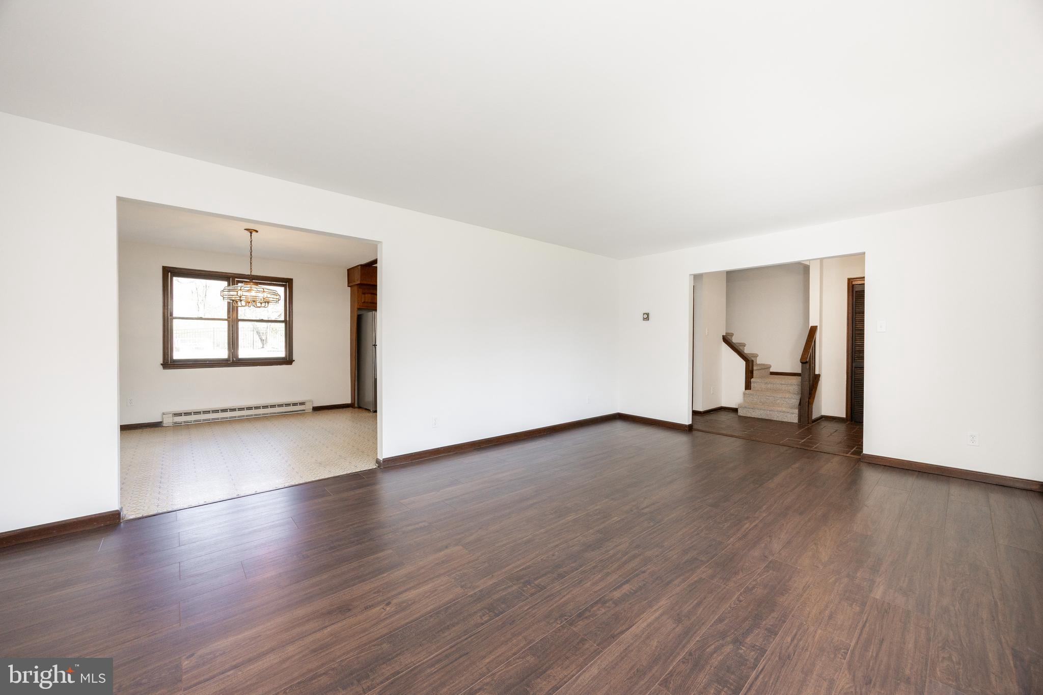 800 Scholl Road Pottstown, PA 19465 - Photo 17 of 49 an empty room with wooden floor and windows