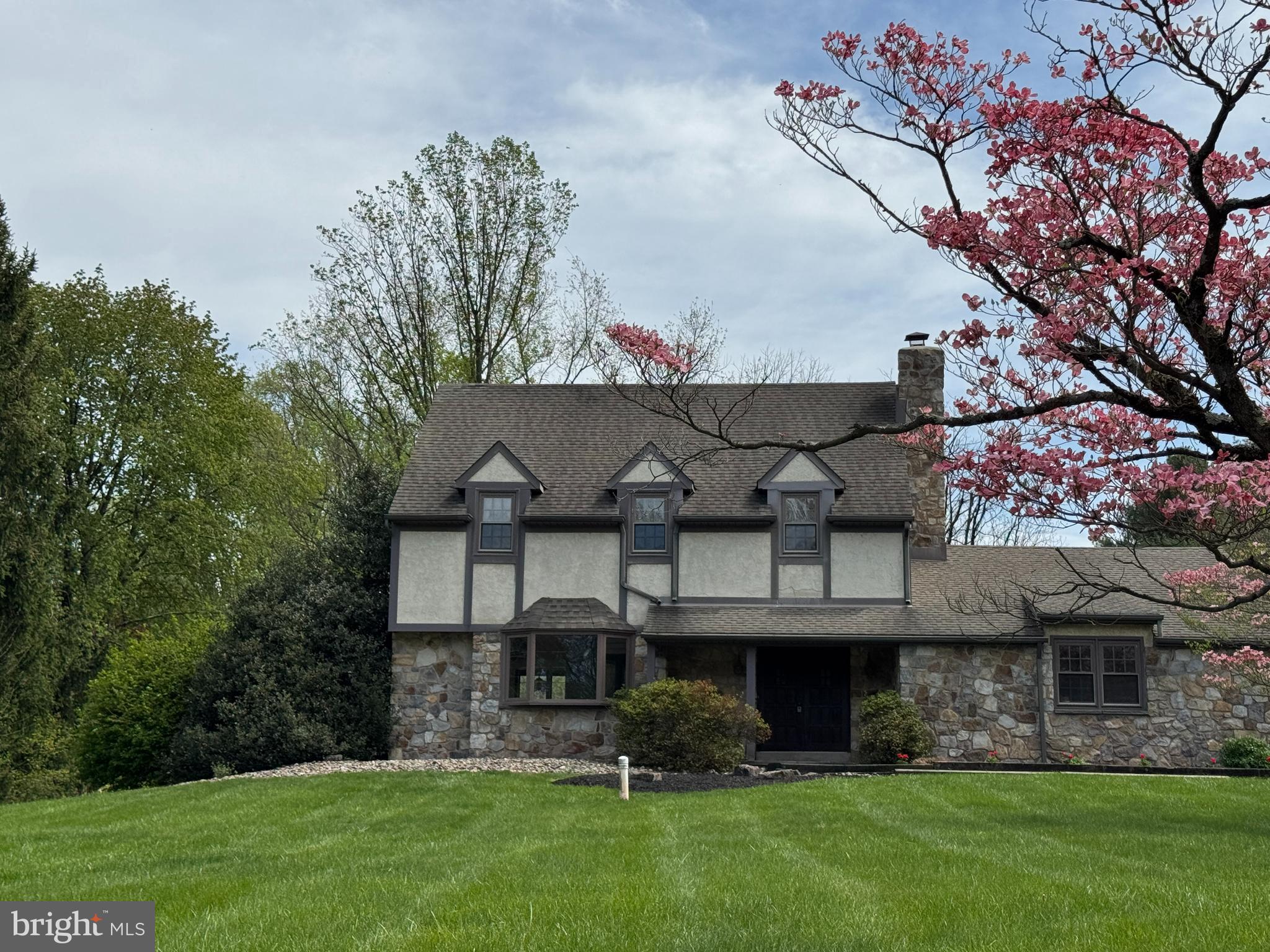 800 Scholl Road Pottstown, PA 19465 - Photo 2 of 49 a front view of a house with a garden and plants
