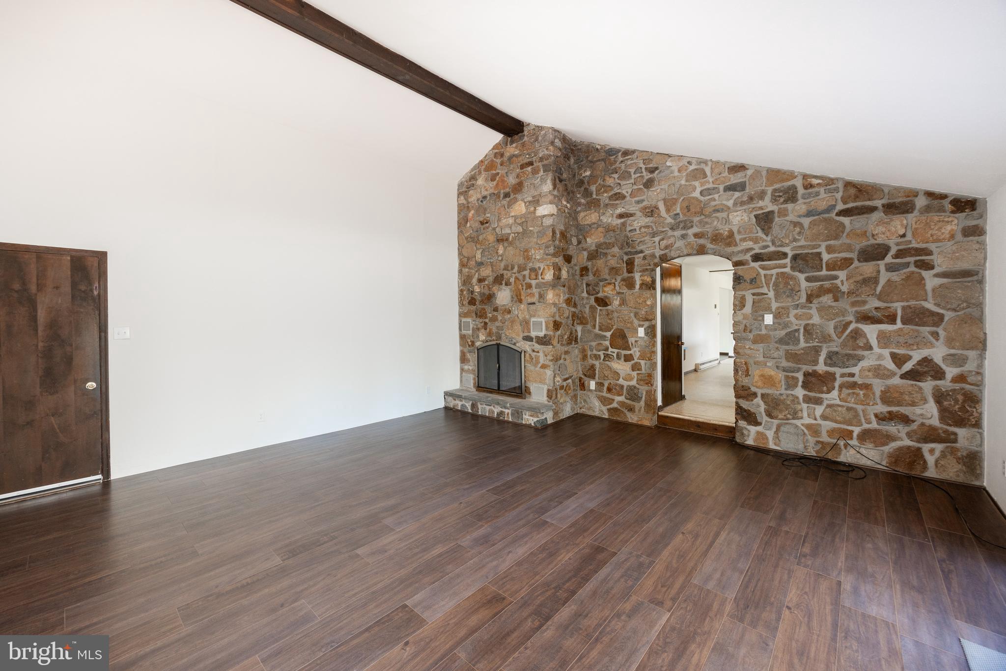 800 Scholl Road Pottstown, PA 19465 - Photo 25 of 49 an empty room with wooden floor and windows