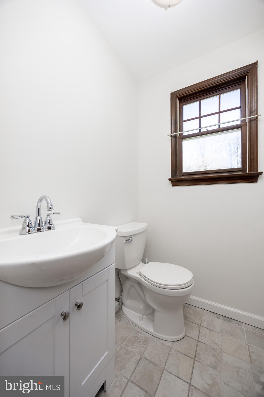 800 Scholl Road Pottstown, PA 19465 - Photo 26 of 49 a bathroom with a sink a toilet and a window
