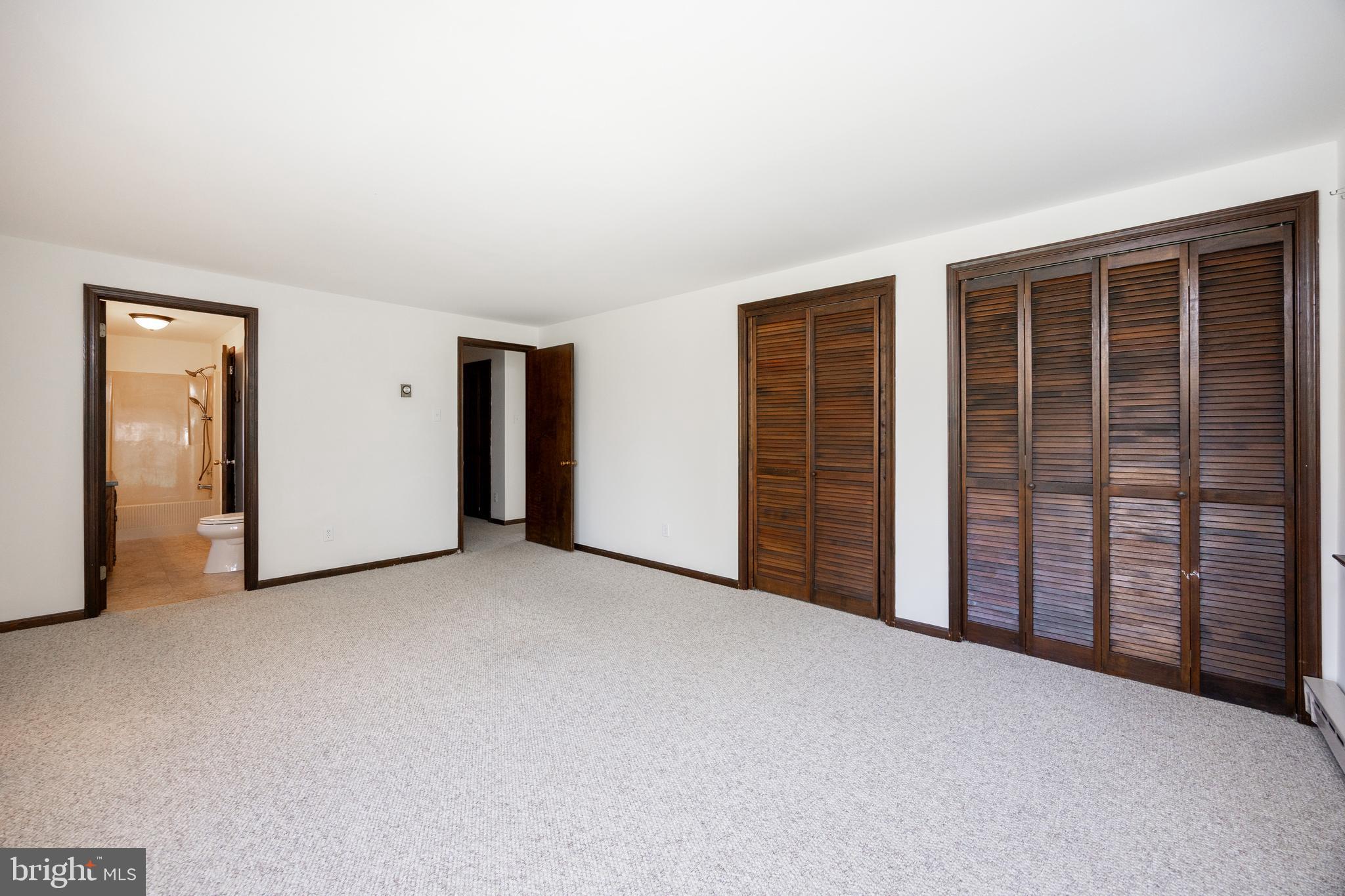 800 Scholl Road Pottstown, PA 19465 - Photo 28 of 49 an empty room with furniture and a window
