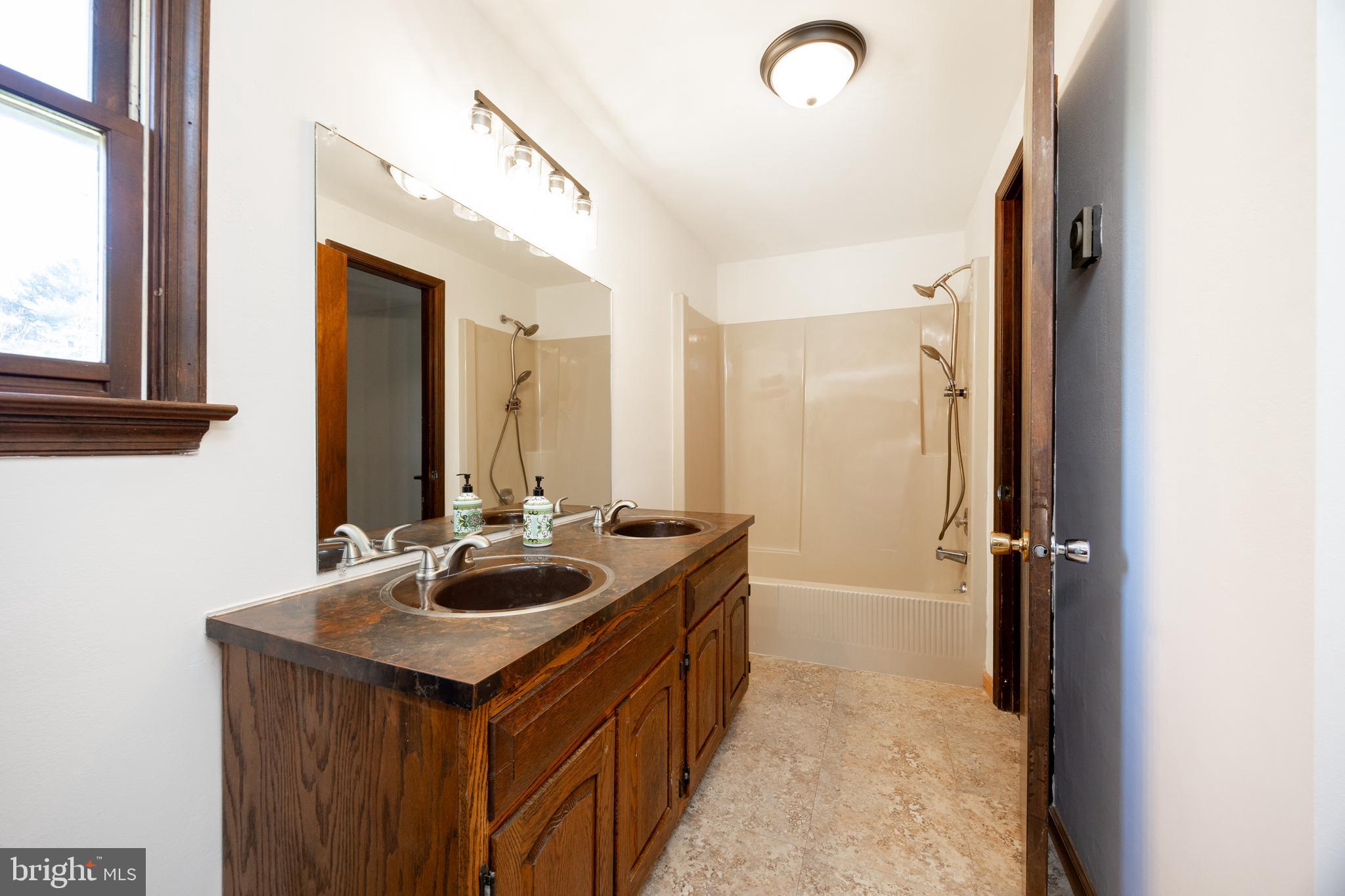 800 Scholl Road Pottstown, PA 19465 - Photo 31 of 49 a bathroom with a sink and a mirror