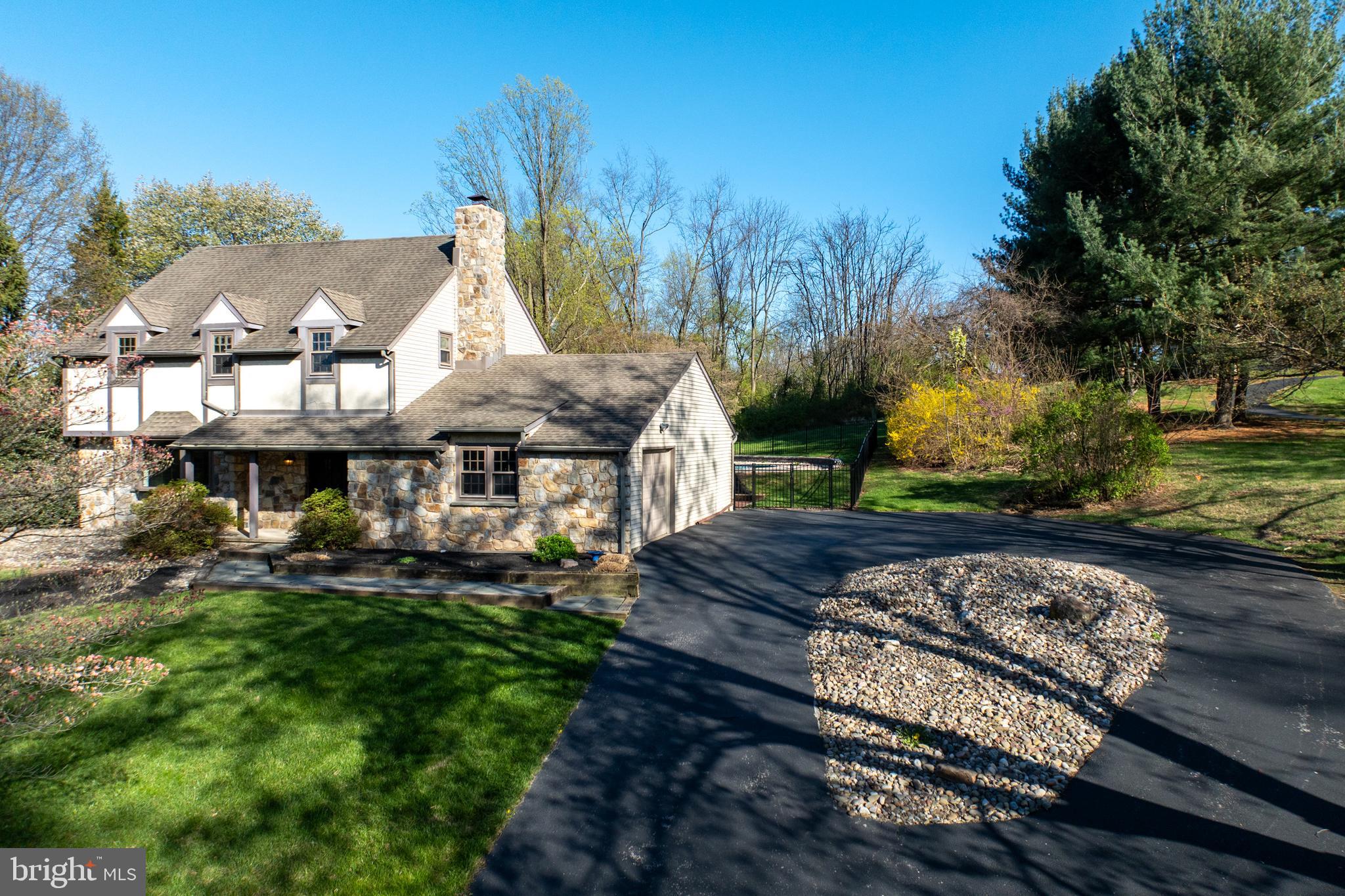 800 Scholl Road Pottstown, PA 19465 - Photo 4 of 49 a front view of a house with garden
