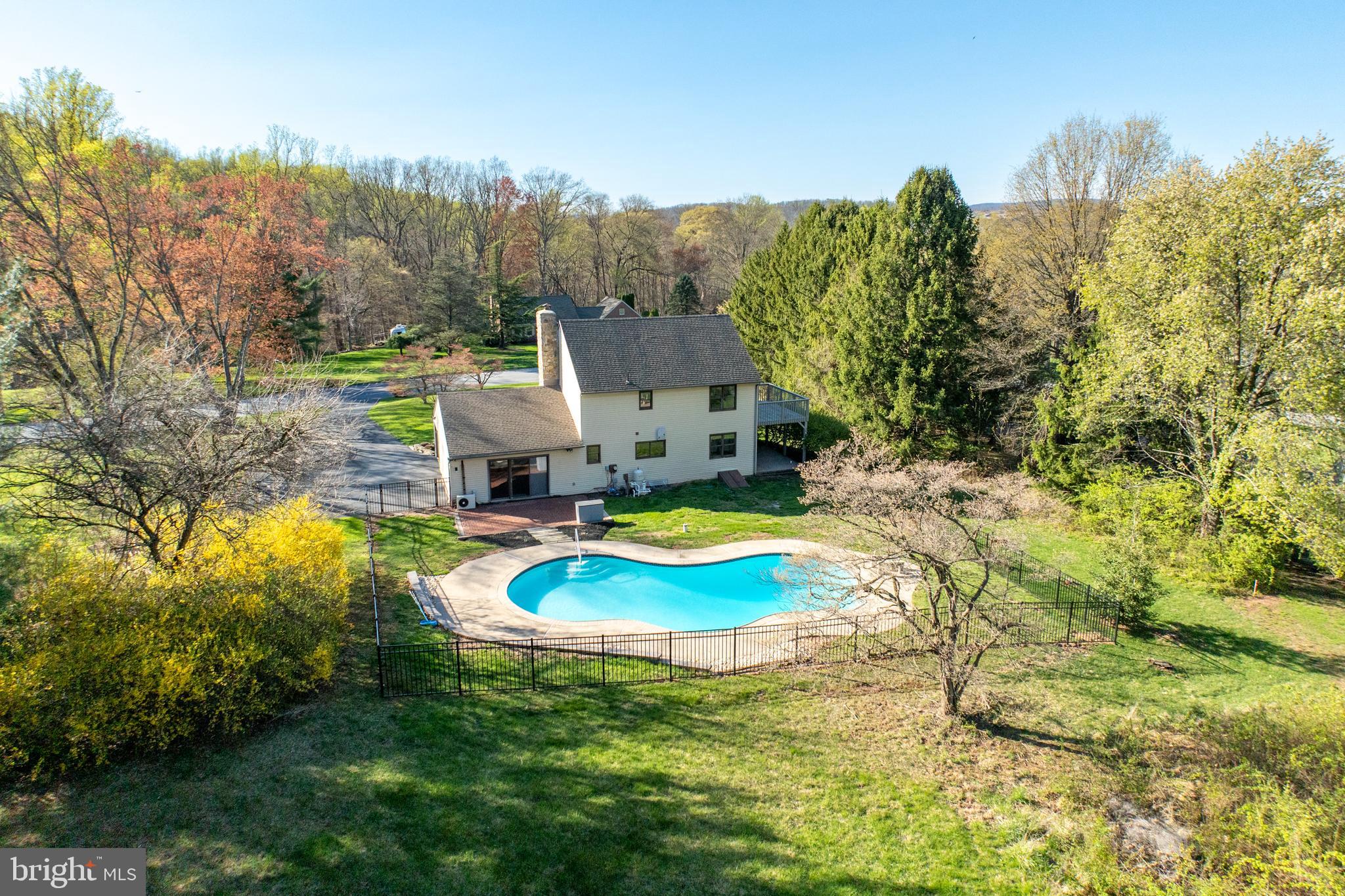 800 Scholl Road Pottstown, PA 19465 - Photo 49 of 49 a view of a house with swimming pool and porch