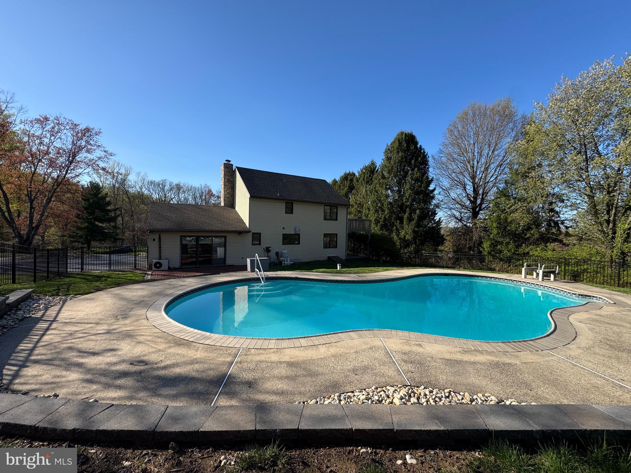 800 Scholl Road Pottstown, PA 19465 - Photo 8 of 49 a view of a swimming pool with an outdoor space