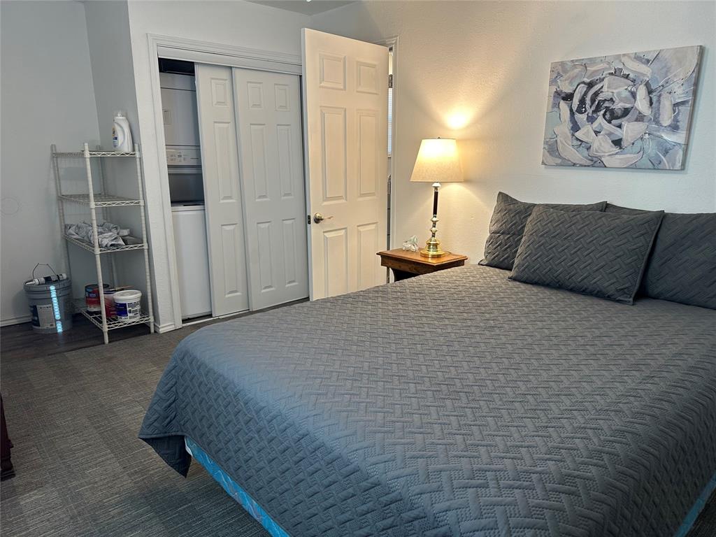 144 Huntoon Trail Mabank, TX 75156 - Photo 6 of 8 a bedroom with a bed and a walk in closet