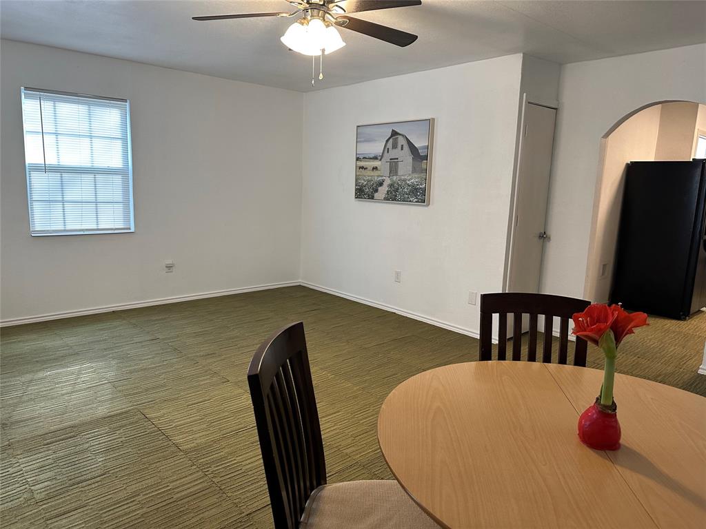 144 Huntoon Trail Mabank, TX 75156 - Photo 7 of 8 a view of a dining room with furniture and wooden floor