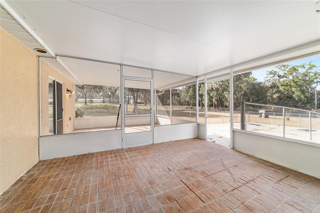 4350 Southwest 89th Avenue Ocala, FL 34481 - Photo 68 of 90 a view of an empty room with wooden floor and a window