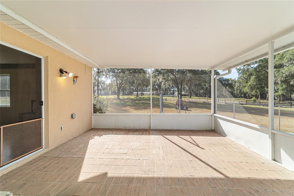 4350 Southwest 89th Avenue Ocala, FL 34481 - Photo 72 of 90 a view of a room with wooden floor and windows