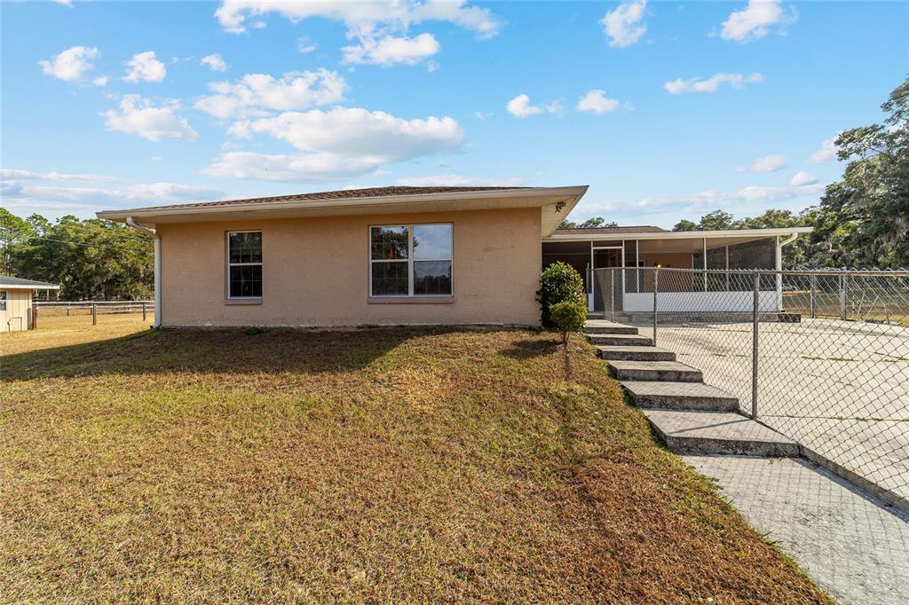 4350 Southwest 89th Avenue Ocala, FL 34481 - Photo 78 of 90 a backyard of a house with trampoline