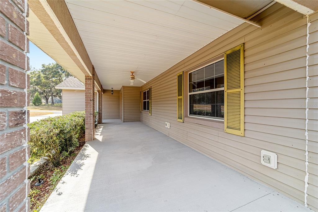 4350 Southwest 89th Avenue Ocala, FL 34481 - Photo 89 of 90 a view of a house with a door and wooden walls