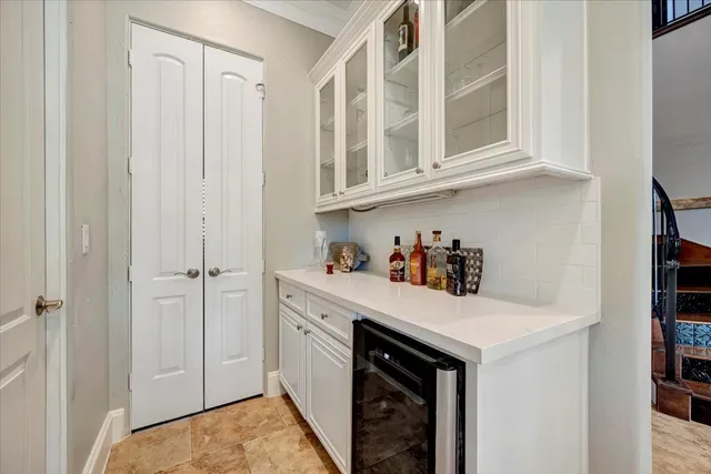a kitchen with cabinets and window
