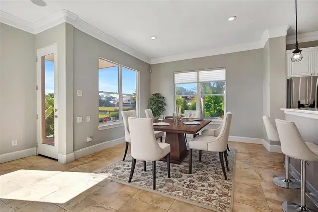 a bedroom with a bed a window and lamps