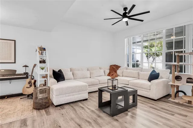 a living room with furniture and a large window