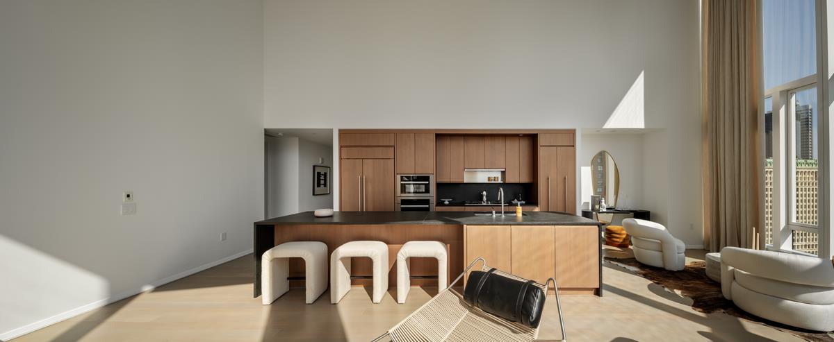 50 West Street, Unit 18C Manhattan, NY 10006 - Photo 2 of 23 a view of kitchen with dining table and chairs