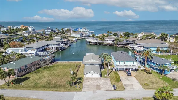 an aerial view of a house with a lake view
