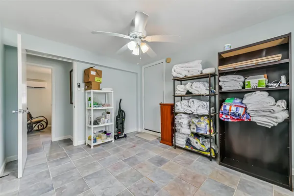 a view of room with racks and storage