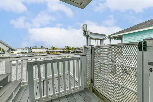 a view of a balcony with wooden floor