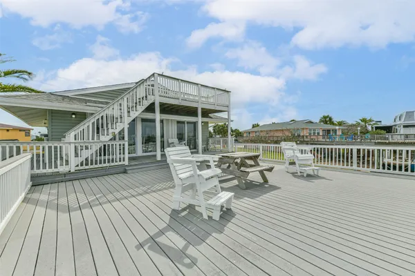 a view of roof deck with patio