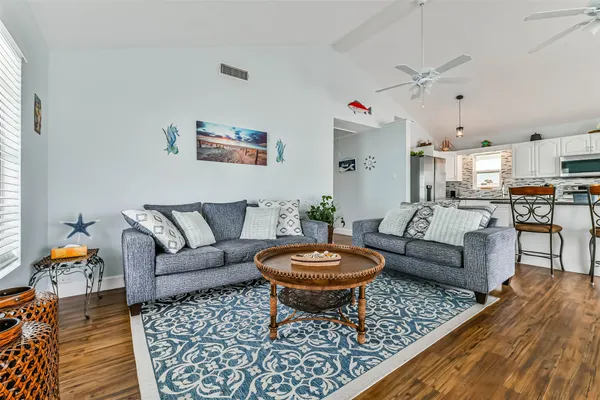 a living room with furniture and a view of living room