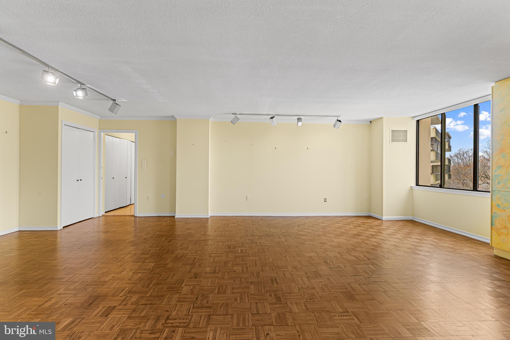 8302 Old York Road, Unit B42 Elkins Park, PA 19027 - Photo 14 of 42 a view of an empty room with window and wooden floor