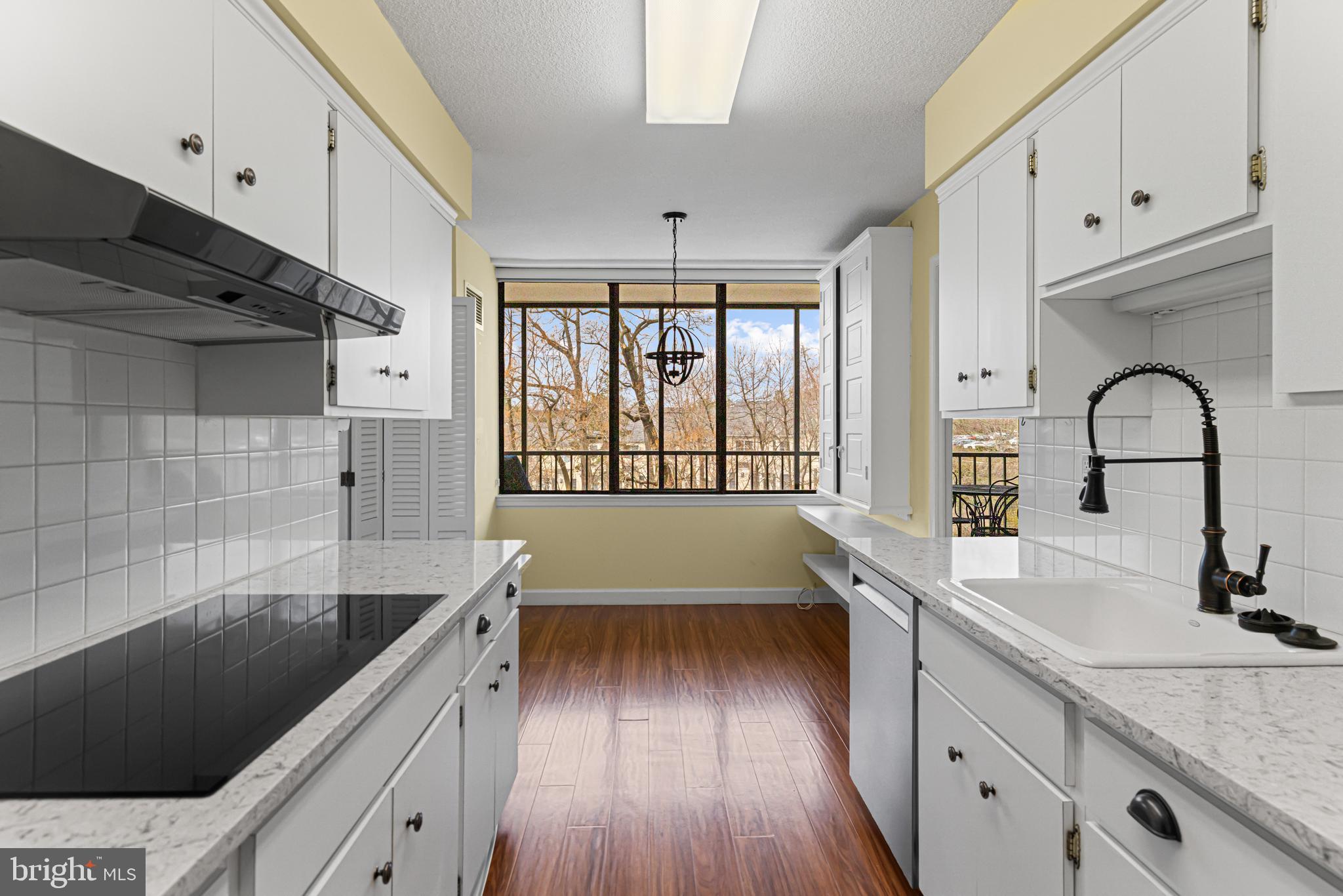8302 Old York Road, Unit B42 Elkins Park, PA 19027 - Photo 18 of 42 a kitchen with granite countertop a sink a counter space appliances and cabinets