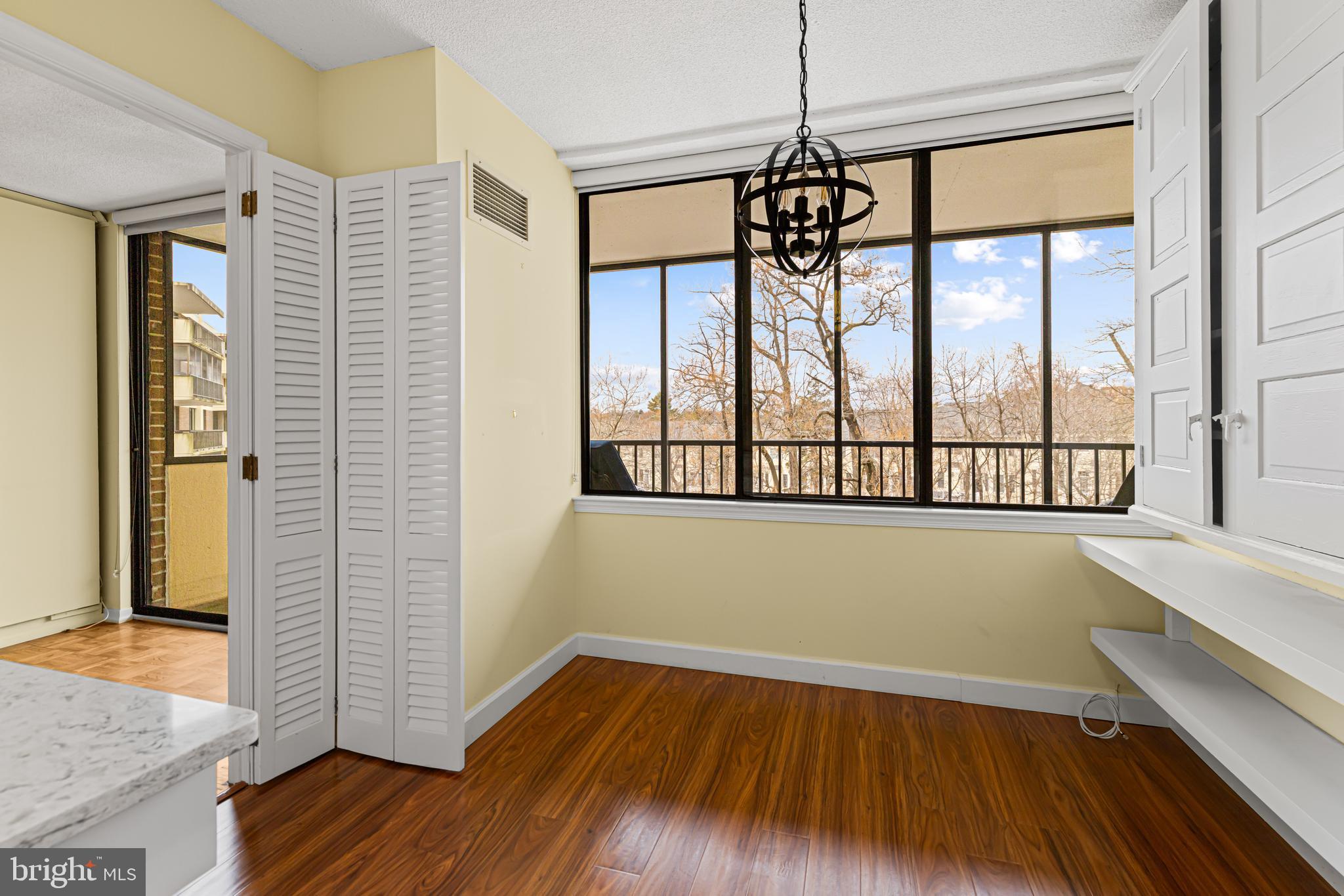 8302 Old York Road, Unit B42 Elkins Park, PA 19027 - Photo 19 of 42 a view of empty room with wooden floor and fan