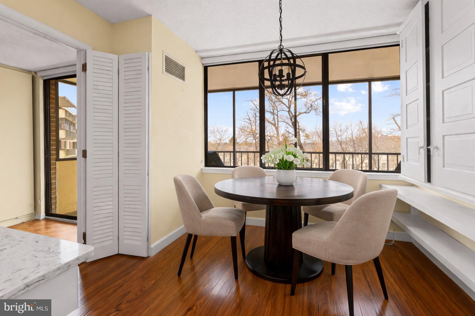 8302 Old York Road, Unit B42 Elkins Park, PA 19027 - Photo 20 of 42 a view of a dining room with furniture window and wooden floor