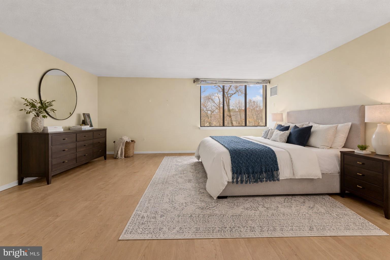8302 Old York Road, Unit B42 Elkins Park, PA 19027 - Photo 27 of 42 a bedroom with a bed and dresser
