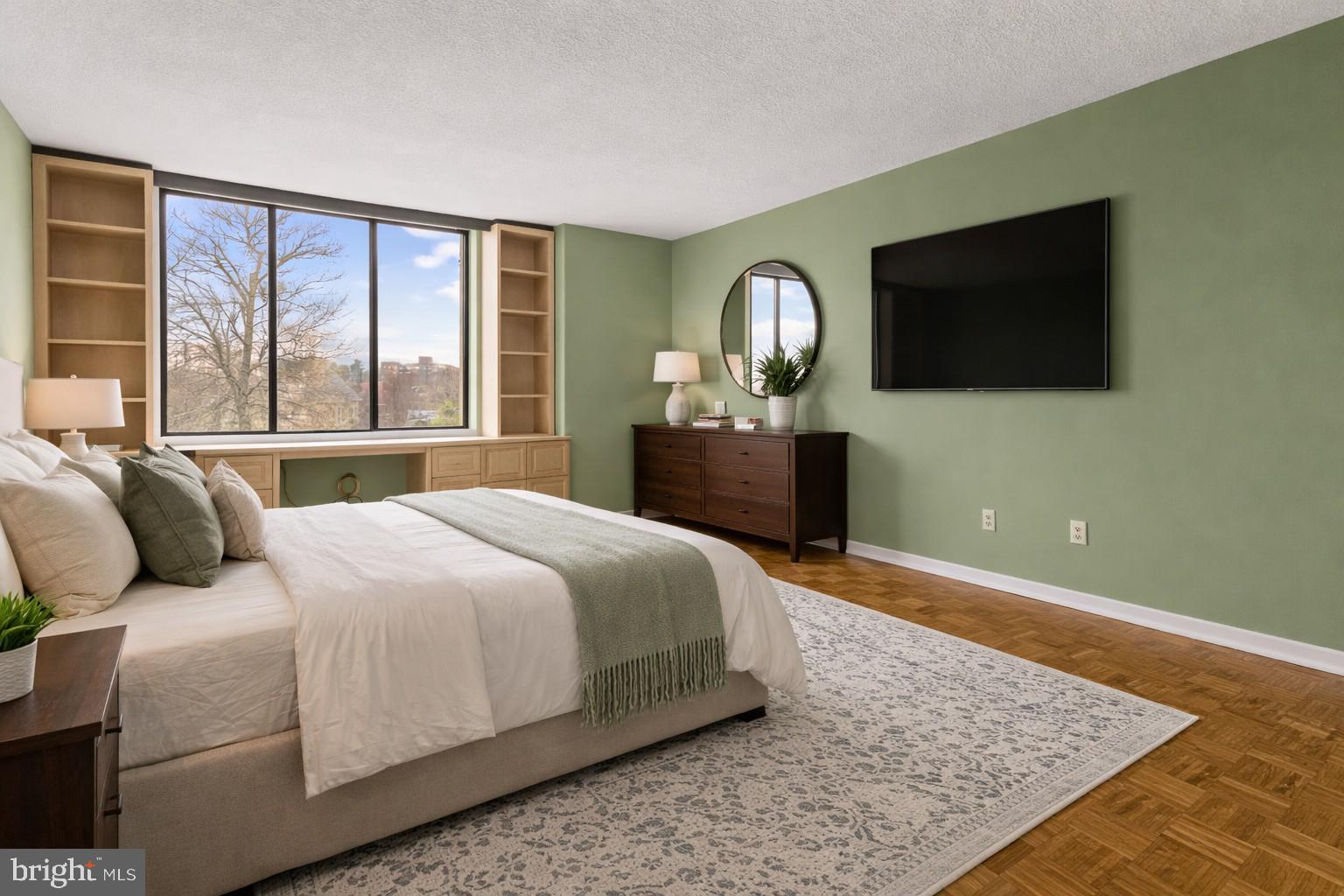 8302 Old York Road, Unit B42 Elkins Park, PA 19027 - Photo 32 of 42 a bedroom with a large bed and a flat screen tv