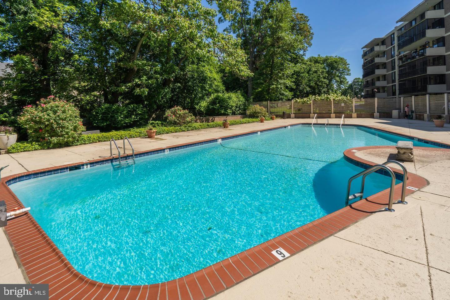 8302 Old York Road, Unit B42 Elkins Park, PA 19027 - Photo 42 of 42 a view of a swimming pool with a seating space