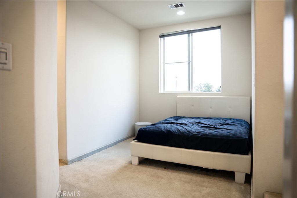 21125 Normandie Avenue Torrance, CA 90501 - Photo 20 of 20 a bed sitting in a bedroom next to a window