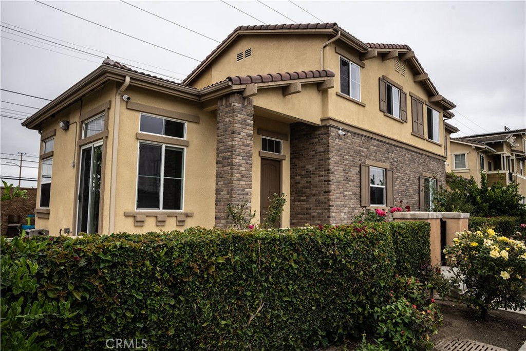 21125 Normandie Avenue Torrance, CA 90501 - Photo 2 of 20 a front view of a house with a yard