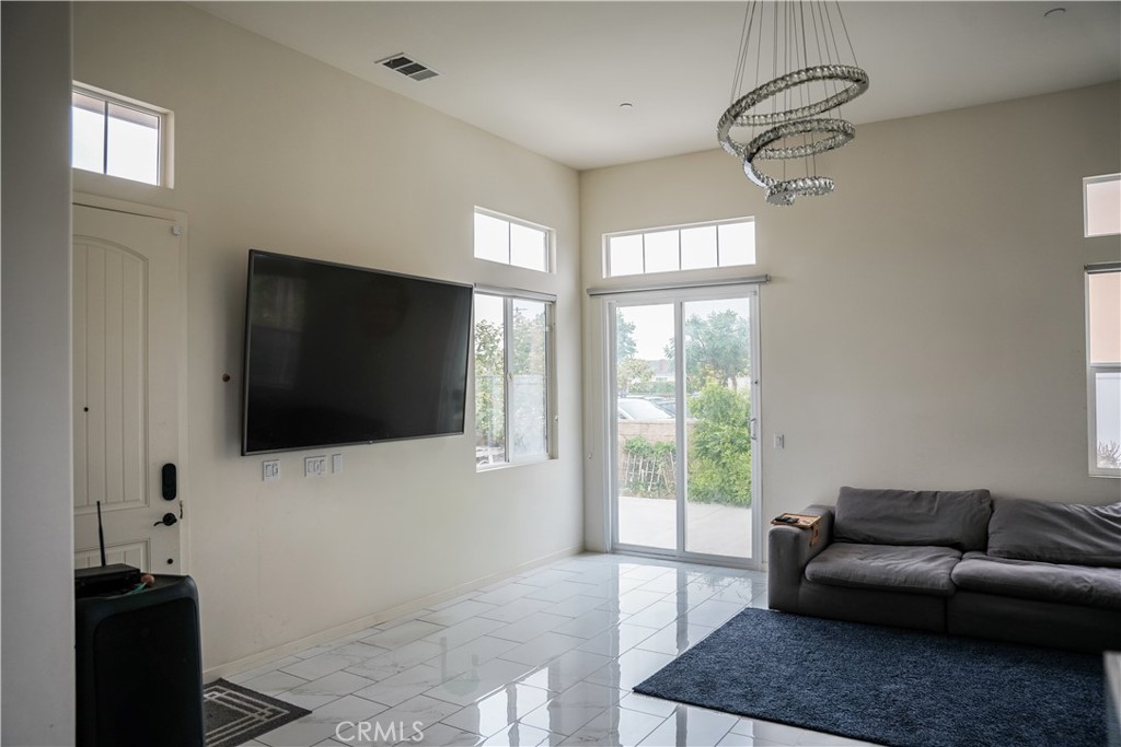 21125 Normandie Avenue Torrance, CA 90501 - Photo 5 of 20 a living room with furniture and a flat screen tv