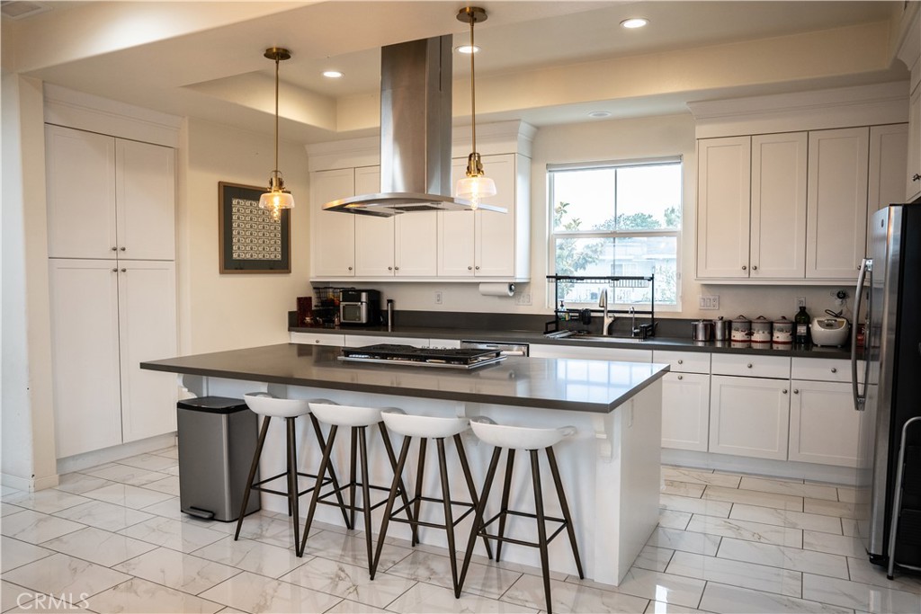 21125 Normandie Avenue Torrance, CA 90501 - Photo 8 of 20 a kitchen with stainless steel appliances granite countertop a stove a sink and a refrigerator